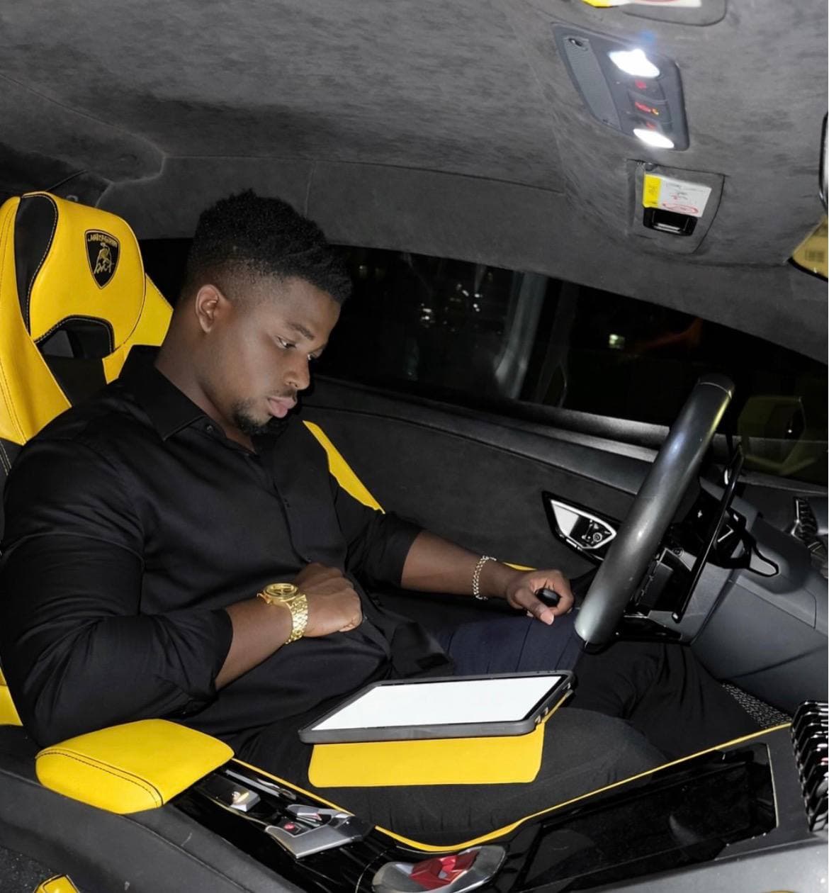MolosoForex Academy founder seated inside a luxury car